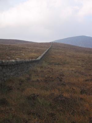 22 miles long and goes over the peaks of 15 mountains.